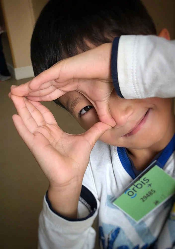 Orbis Flying Eye Hospital Project - Ulaanbaatar, Mongolia - August 12-30, 2018.—.Media consented patient #29485 — Khash-Erdene, age 7, flashed the ‘camera